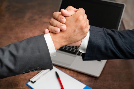 Two Professional Well-Dressed Corporate Businessmen Handshake Indoors