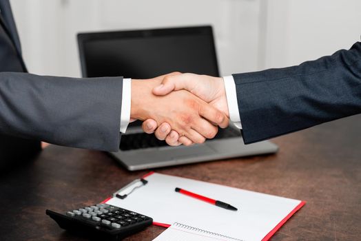 Two Professional Well-Dressed Corporate Businessmen Handshake Indoors