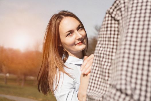 Romantic couple in the autumn park - sunny day - love, relationship and dating concept