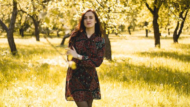 Beautiful Young Woman Outdoor. Enjoy Nature. Healthy Smiling Girl in the Spring Park. Sunny day