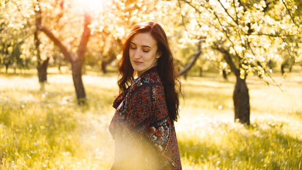 Beautiful Young Woman Outdoor. Enjoy Nature. Healthy Smiling Girl in the Spring Park. Sunny day