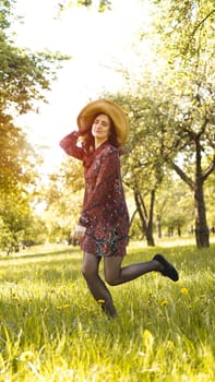 Beautiful Young Woman Outdoor. Enjoy Nature. Healthy Smiling Girl in the Spring Park. Sunny day