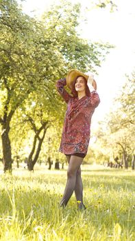 Beautiful Young Woman Outdoor. Enjoy Nature. Healthy Smiling Girl in the Spring Park. Sunny day