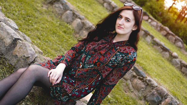 Attractive young woman enjoying her time outside in park - summer time