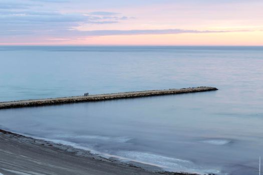 Spectacular and colorful sunset in the bay of Santa Pola, Alicante, Spain in autumn