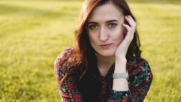 Attractive young woman enjoying her time outside in park - summer time