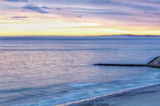 Spectacular and colorful sunset in the bay of Santa Pola, Alicante, Spain in autumn