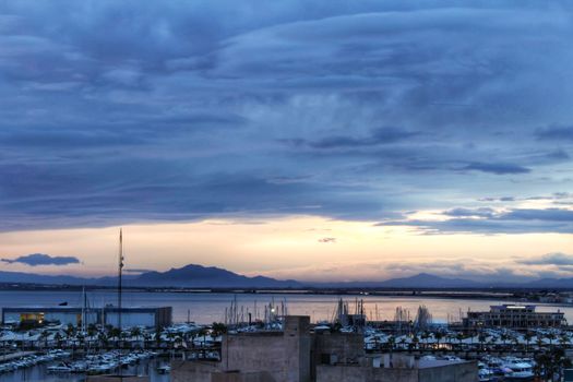 Spectacular and colorful sunset in the bay of Santa Pola, Alicante, Spain in autumn