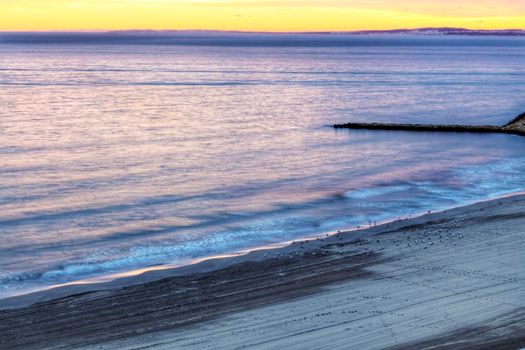 Spectacular and colorful sunset in the bay of Santa Pola, Alicante, Spain in autumn