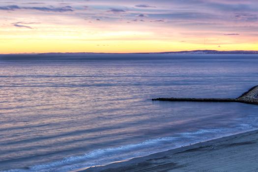 Spectacular and colorful sunset in the bay of Santa Pola, Alicante, Spain in autumn