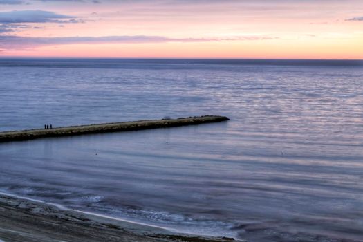 Spectacular and colorful sunset in the bay of Santa Pola, Alicante, Spain in autumn