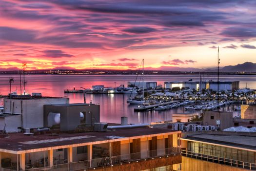 Spectacular and colorful sunset in the bay of Santa Pola, Alicante, Spain in autumn