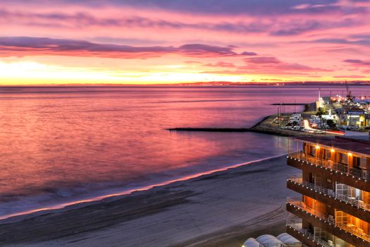 Spectacular and colorful sunset in the bay of Santa Pola, Alicante, Spain in autumn