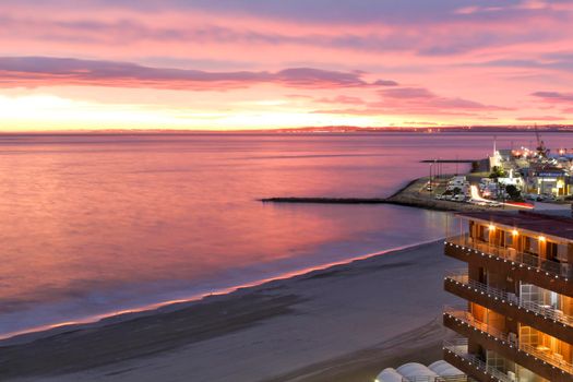 Spectacular and colorful sunset in the bay of Santa Pola, Alicante, Spain in autumn