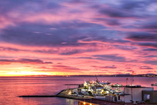 Spectacular and colorful sunset in the bay of Santa Pola, Alicante, Spain in autumn