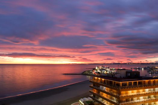 Spectacular and colorful sunset in the bay of Santa Pola, Alicante, Spain in autumn