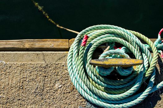 Blue Coiled rope in the dock in the morning