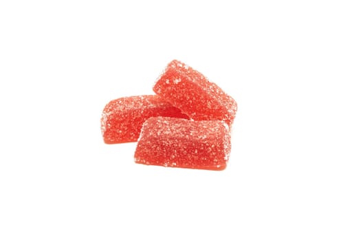 Three marmalade candies close up, isolated on white background