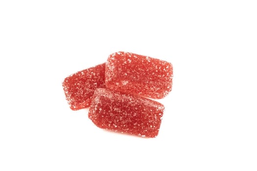 Three marmalade candies close up, isolated on white background
