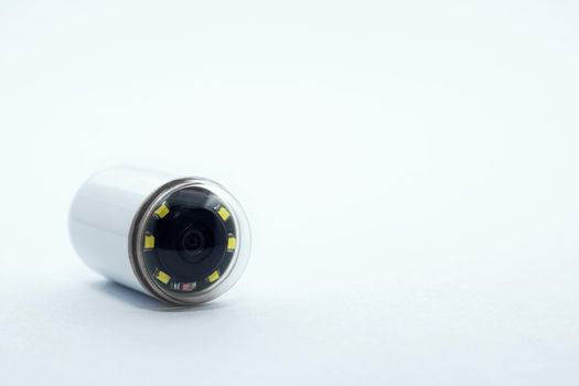 Capsule with camera for capsular endoscopy close up on white background, copy space