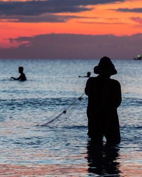 A fisherman is fishing at Sunset on Koh Rong