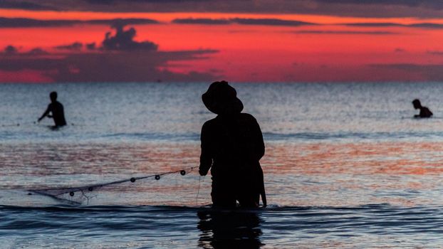 A fisherman is fishing at Sunset on Koh Rong