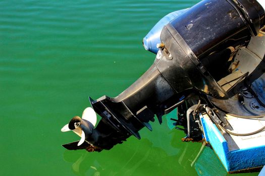 Old and powerful outboard motor in the mediterranean sea