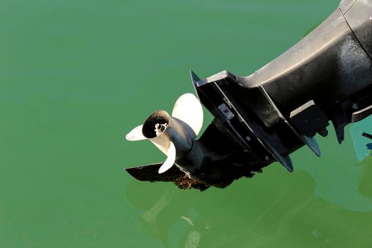 Old and powerful outboard motor in the mediterranean sea