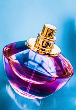 Perfume bottle on glossy background, sweet floral scent, glamour fragrance and eau de parfum as holiday gift and luxury beauty cosmetics brand design.