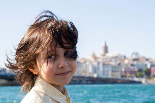 Photo of  boy with Istanbul Galata Tower panorama behind