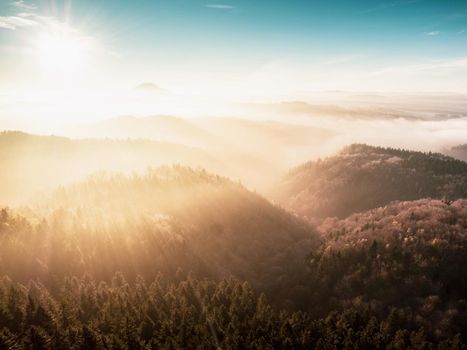 Beautiful misty sunset in hilly landscape. Nature travel and adventure concept