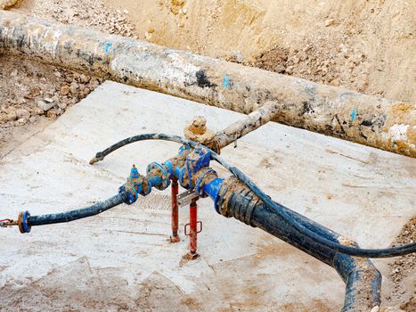 Pipeline with valves connect pumps used to transfer fresh water at public utility. Regular maintenance of water supply system