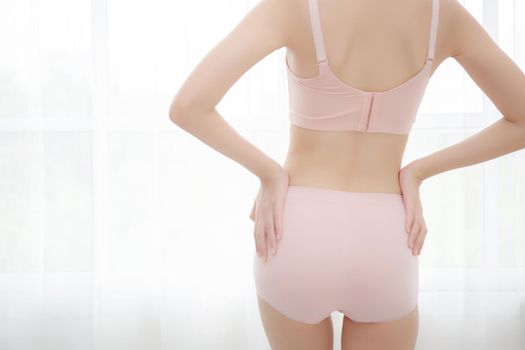 Closeup bottom of asian sexy woman in underwear beautiful body slim shape slender with diet at room, girl is weight loss with perfect body of buttock at home, healthy and lifestyle concept.