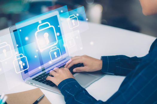 Digital network and cyber security for safe and privacy about data, businessman using laptop computer while display futuristic virtual lock guard for protection crime and hacker, business concept.