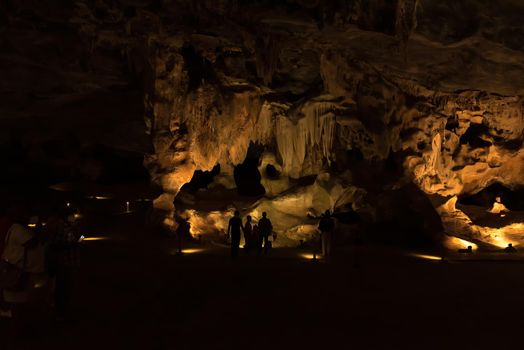 Silhouettes of people against rock formations in the Cango Caves near Oudthoorn in the Western Cape Karoo