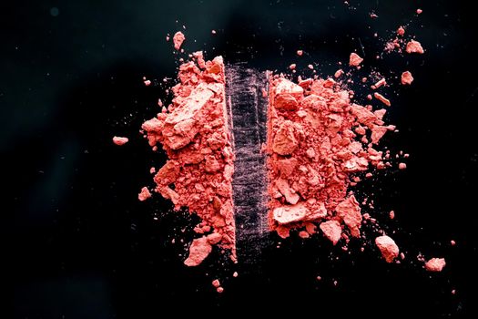 Crushed cosmetics, mineral organic eyeshadow, blush and cosmetic powder isolated on black background, makeup and beauty banner, flatlay design.