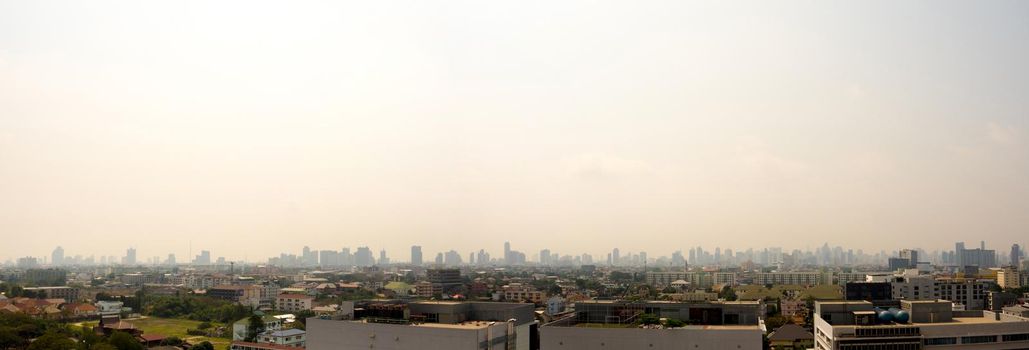 Bangkok City downtown cityscape urban skyline in the mist or smog. Wide and High view image of Bangkok city in the 
smog