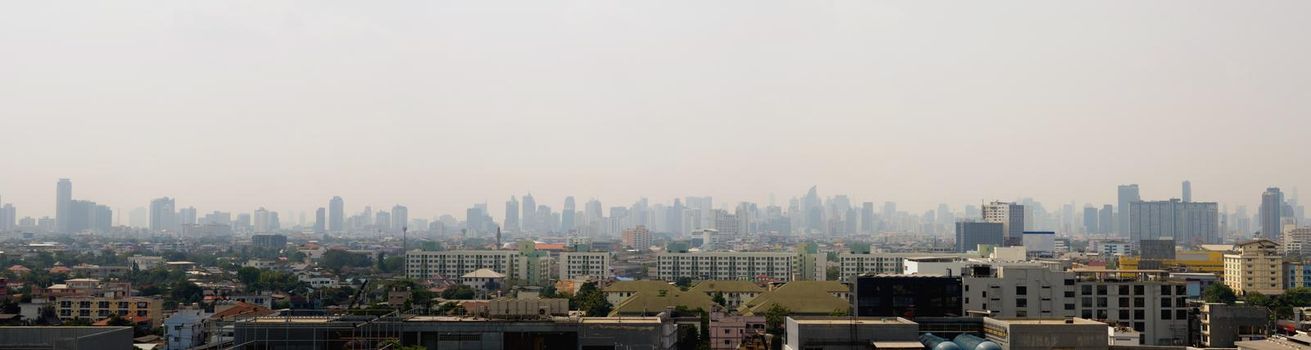 Bangkok City downtown cityscape urban skyline in the mist or smog. Wide and High view image of Bangkok city in the 
smog