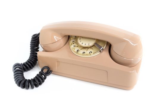 Vintage telephone. Pink old telephone isolated on white background.