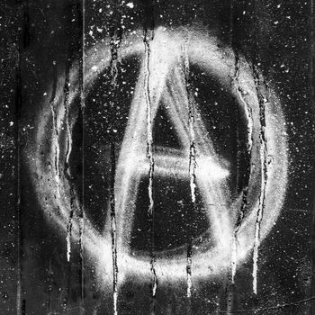 Anarchy symbol painted on grungy concrete wall. Ideal for concepts and backgrounds.