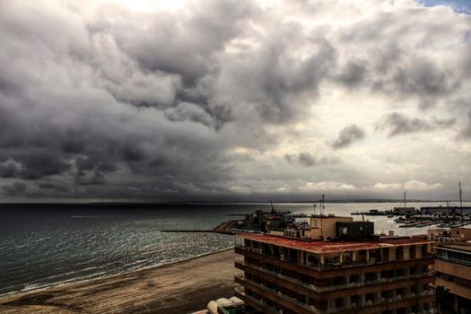 Beach under stormy sky in Santa Pola, Alicante, Spain