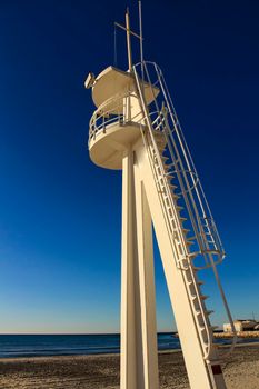 Lifeguard tower on a quiet and lonely beach in a sunny day in southern Spain, Alicante.