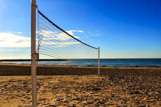 Volleyball net on the beach in the morning