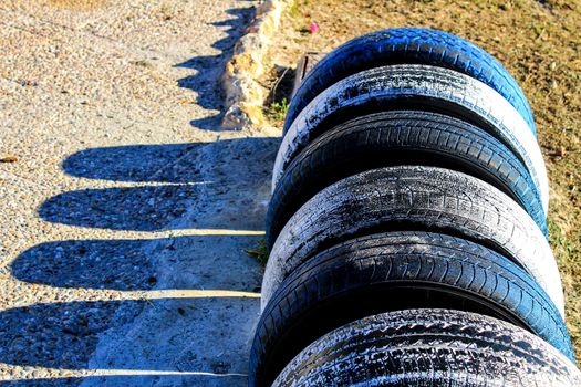Ecological bicycle parking made with tires on the beach in Santa Pola, Spain
