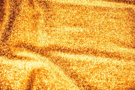 Luxe glowing texture, night club branding and New Years party concept - Golden holiday sparkling glitter abstract background, luxury shiny fabric material for glamour design and festive invitation