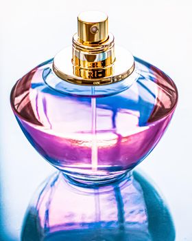 Perfume bottle on glossy background, sweet floral scent, glamour fragrance and eau de parfum as holiday gift and luxury beauty cosmetics brand design.