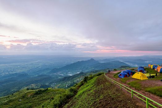 High view beautiful nature landscape of colorful sky during the sunrise from the campsite at Phu Thap Berk viewpoint, famous tourist attractions of Phetchabun Province, Thailand