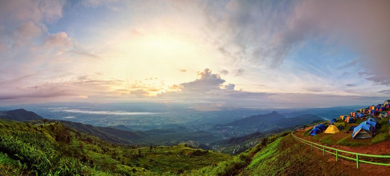 Panorama high view beautiful nature landscape of colorful sky during the sunrise from the campsite at Phu Thap Berk viewpoint, famous tourist attractions of Phetchabun Province, Thailand