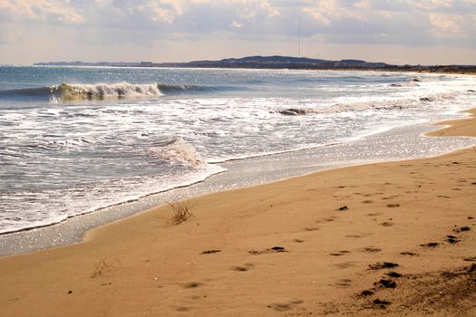 Sunny day on the beach in winter in La Marina, Alicante