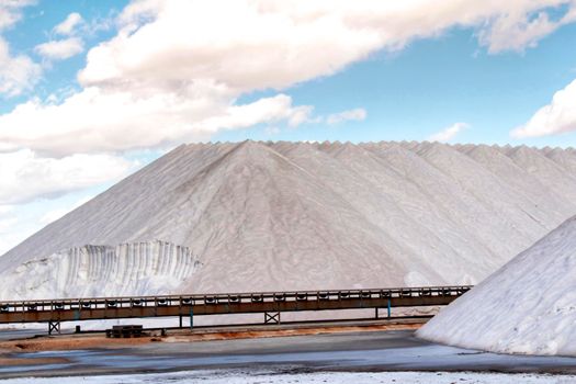 Salt mountains under blue sky in Santa Pola, Spain